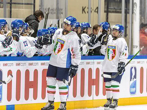 Italy players celebrate on the field