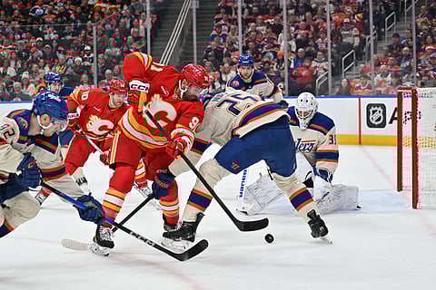 Edmonton Oilers and Calgary Flames players in action