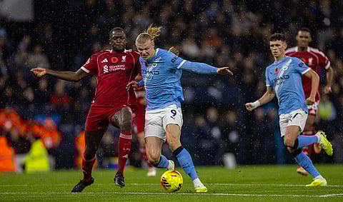 Manchester City and Liverpool players in action during the first leg tie
