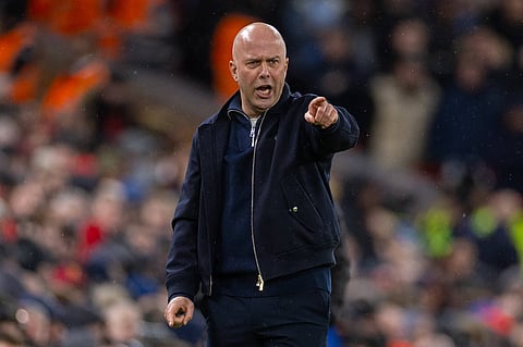 Arne Slot reacts from the touchline against Manchester City