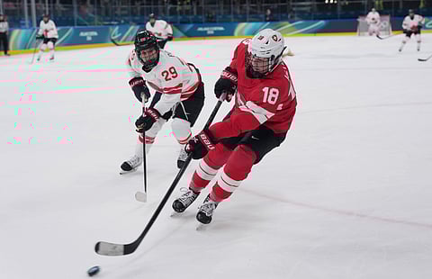 Canada and Switzerland players in action at the Winter Olympics