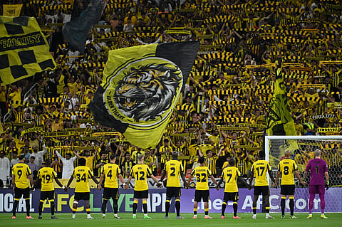 Al-Ittihad players applauds the fans