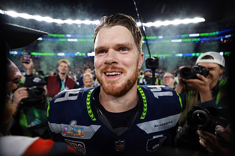 Sam Darnold celebrates after defeating New England Patriots