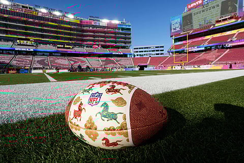 Horse Zodiac Art Football is seen on the ground before the NFL Super Bowl LX