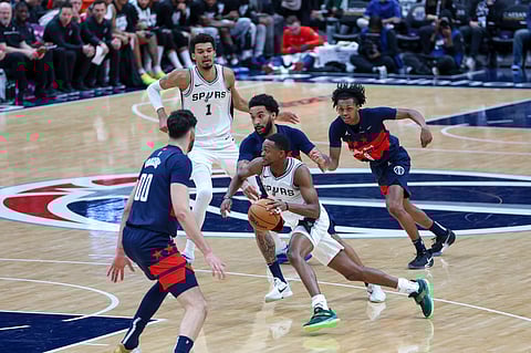San Antonio Spurs' De'Aaron Fox handles the ball