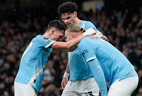 Erling Haaland celebrates his goal with Phil Foden