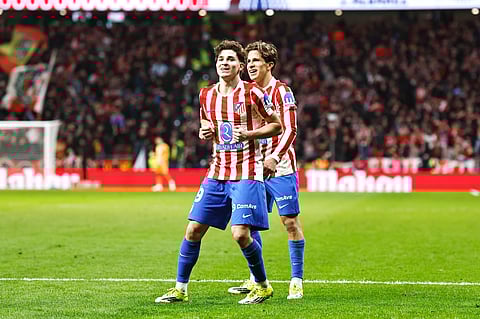 Julian Alvarez celebrates his goal with Giuliano Simeone