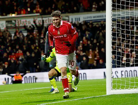 Josh Windass of Wrexham celebrates his goal against Ipswich Town
