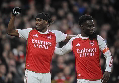 Noni Madueke and Bukayo Saka celebrate