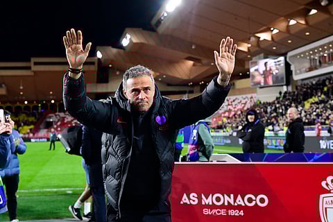 Luis Enrique applauds the travelling fans at full-time