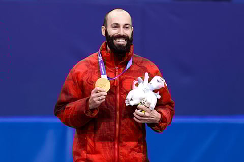 Steven Dubois poses with the Gold medal