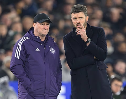 Michael Carrick with assistant coach Steve Holland