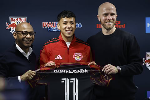 Michael Bradley alongside Jorge Ruvalcaba and Julian de Guzman