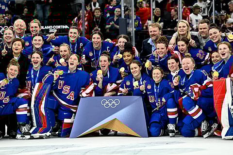 Team USA pose for a photo with the Gold Medal