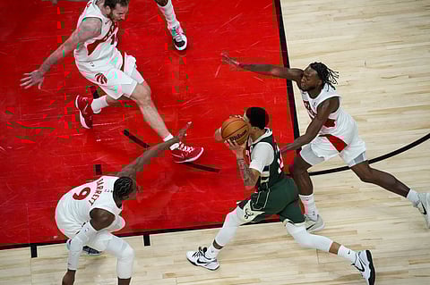 Ryan Rollins of Milwaukee Bucks carries the ball forward