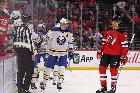 Tage Thompson celebrates his goal with teammates