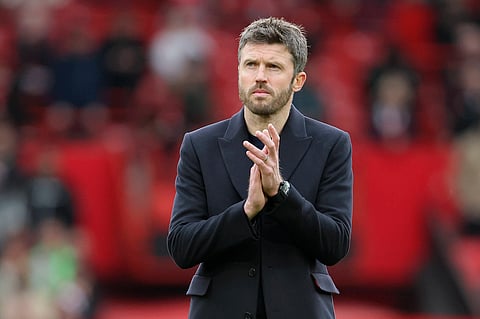 Michael Carrick applauds the fans at full-time at Old Trafford