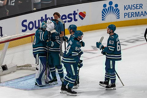 San Jose Sharks players celebrate their goal