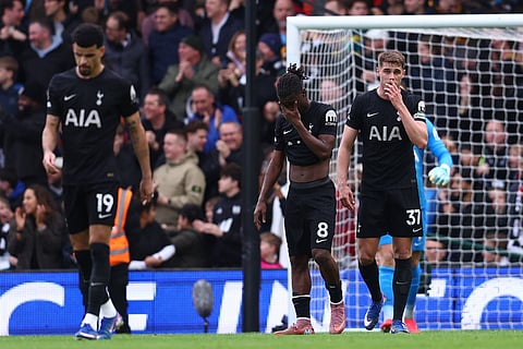 Tottenham Hotspur players look dejected after losing to Fulham