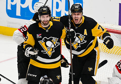 Pittsburgh Penguins' Tommy Novak and Evgeni Malkin