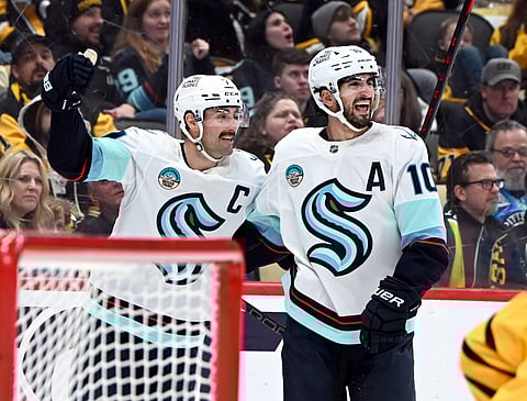 Seattle Kraken players celebrate a goal