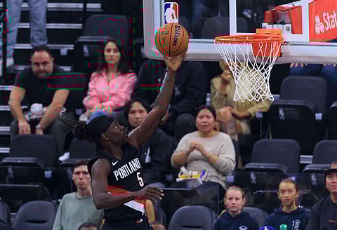 Jrue Holiday goes for a layup