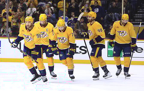Nashville Predators players celebrate a goal