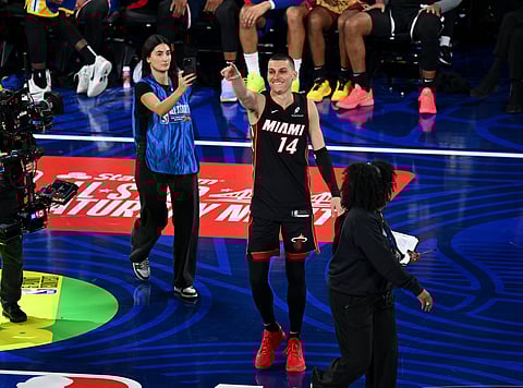Tyler Herro celebrates a 3-pointer