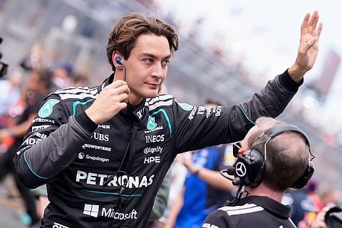 George Russell waves to the crowd