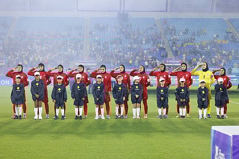 Iran team salutes the national anthem before their game against Philippines