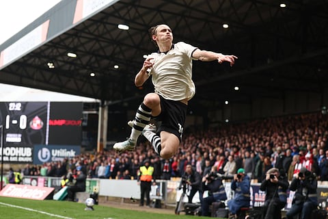 Ben Waine celebrates after scoring the winner for Port Vale