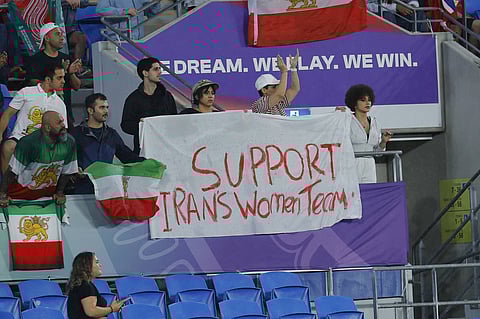 Iran fans holding banner in support for the Iran women's team during the Asian Cup