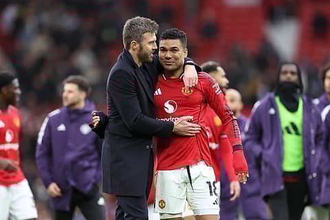 Michael Carrick with Casemiro at full-time