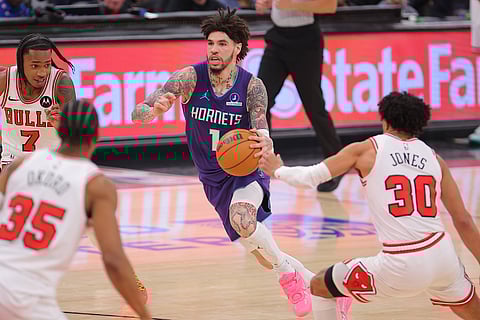 LaMelo Ball drives with the ball