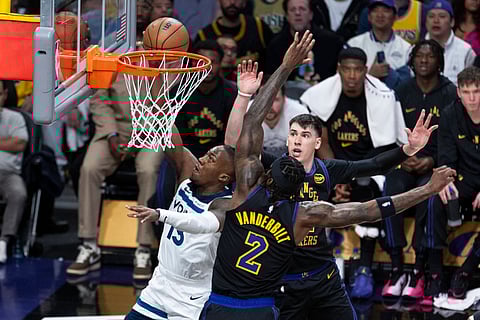 Ayo Dosunmu goes for a layup