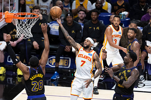 Nickeil Alexander-Walker goes for a layup