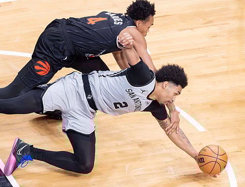 Dylan Harper fights for the ball