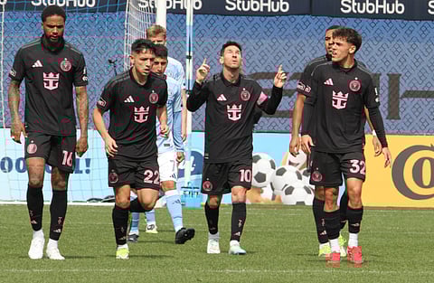 Lionel Messi celebrates his goal with teammates