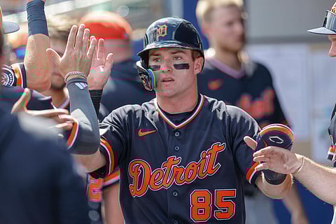 Kevin McGonigle gets high fives in the dugout