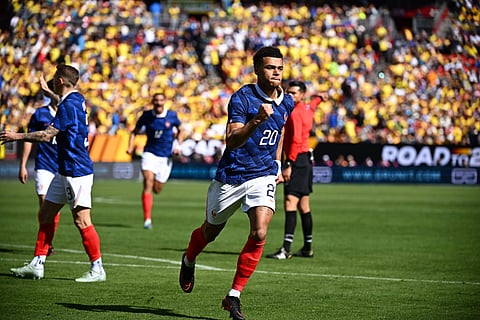 Desire Doue celebrates his first goal for France