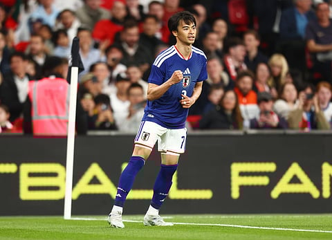 Kaoru Mitoma celebrates his winning goal against England