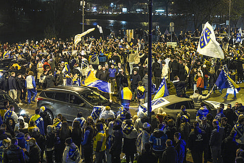Fans celebrate in the streets of Sarajevo after Bosnia and Herzegovina qualify for FIFA World Cup