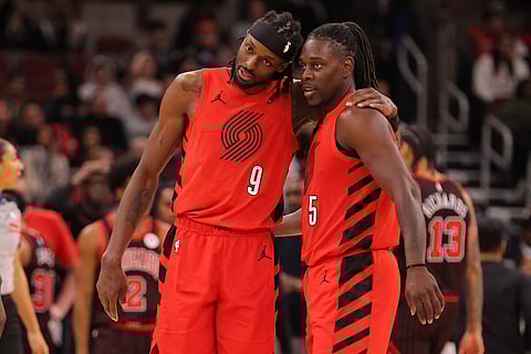 Jrue Holiday with Jerami Grant