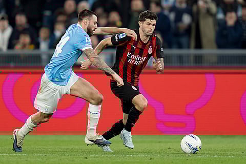 Christian Pulisic and Mario Gila compete for the ball