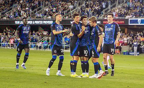 Niko Tsakiris celebrates his goal with teammates