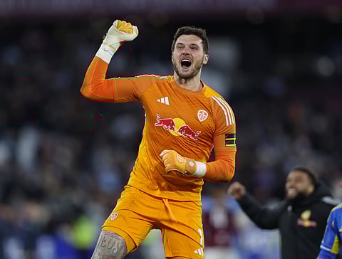 Lucas Perri punches in the air after his heroics helped Leeds United move to semi-final