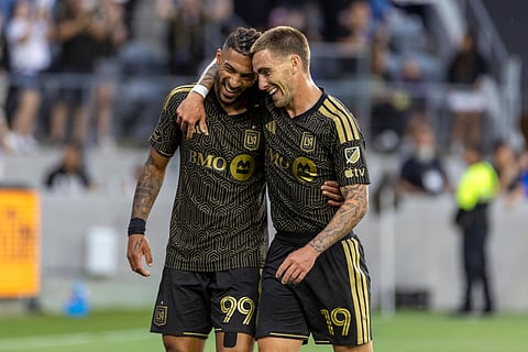 Hat-trick hero Denis Bouanga celebrates with Tyler Boyd