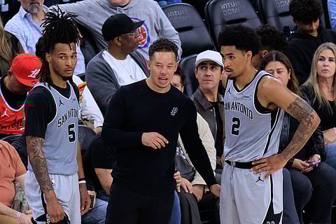 San Antonio Spurs head coach Mitch Johnson gives instructions to his players
