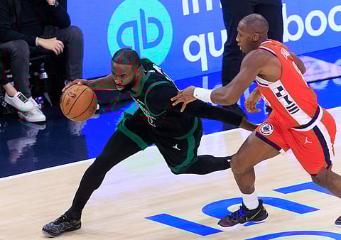 Jaylen Brown moves forward with the ball