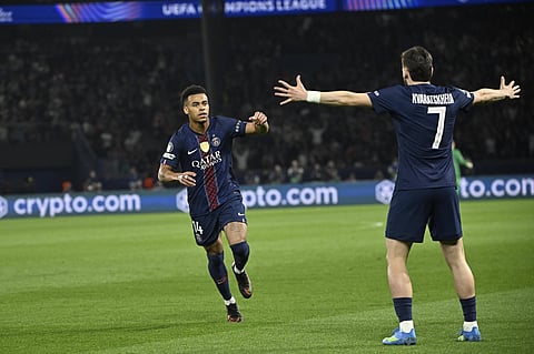 Desire Doue celebrates his goal with Khvicha Kvaratskhelia